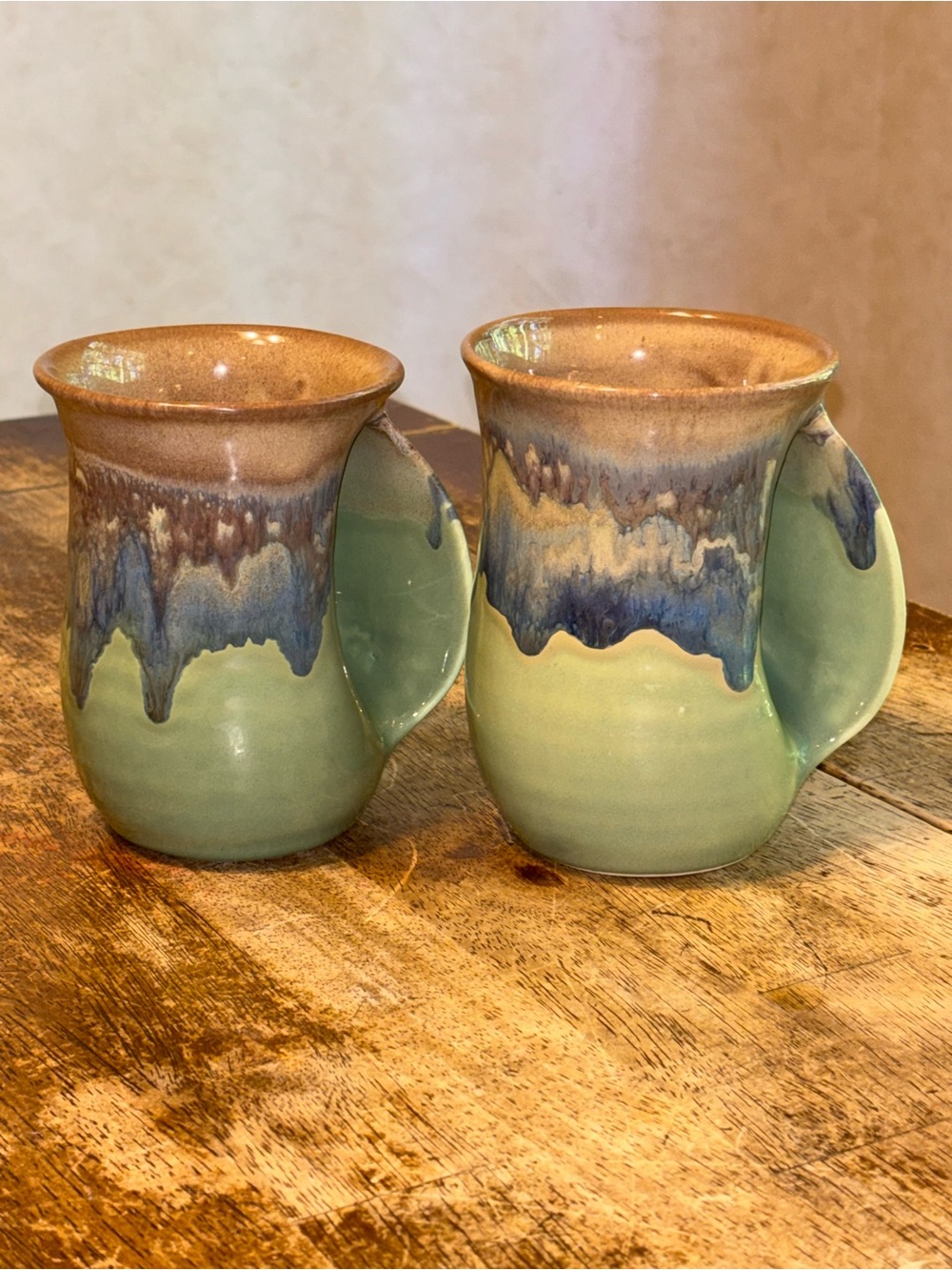 2013 & 2017 Neher Clay in Motion Mossy Creek Pottery Hand Warmer Mugs - Set of 2